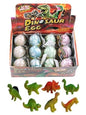  Display box holding 12 pastel-colored dinosaur eggs, with assorted toy dinosaur figures shown below.
