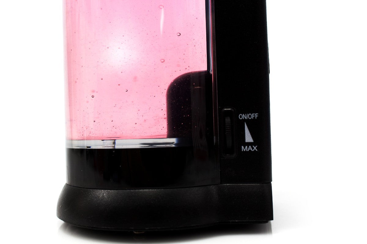 Close-up of the dispenser’s side control marked ON/OFF and MAX beside the reservoir and black base.