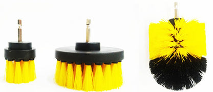 Close-up of three yellow and black drill brush attachments with their metal shafts visible.